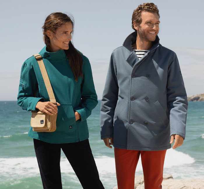 Woman and man wearing colorful Mousqueton outfits