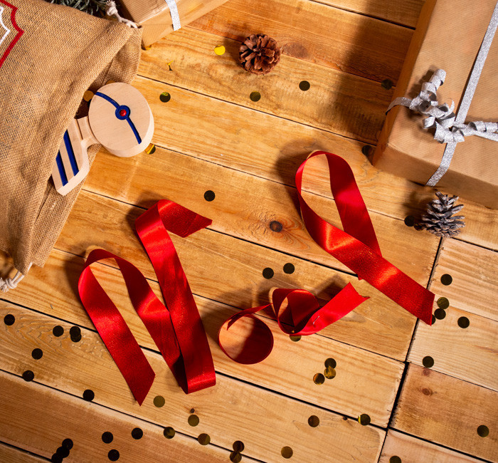 Christmas written with a red ribbon