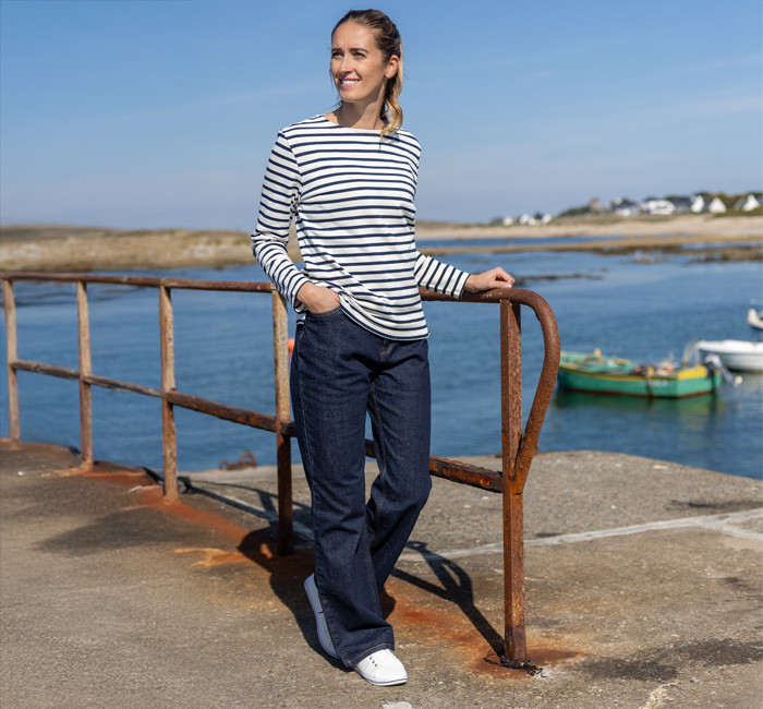 Woman wearing navy blue raw denim jeans made in France Mousqueton