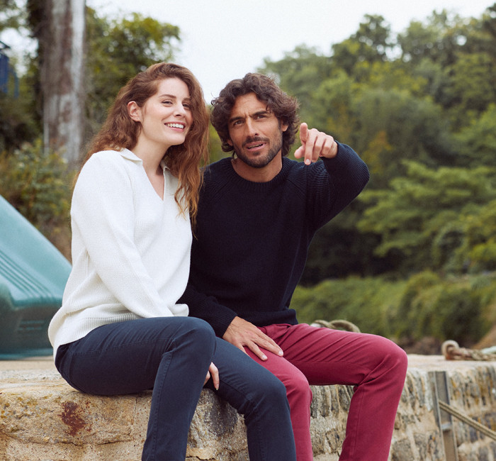 woman wearing a white sweater and man wearing a marine blue sweater