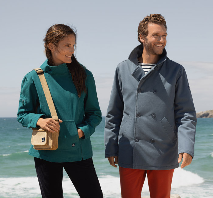 Woman and man wearing colorful Mousqueton outfits