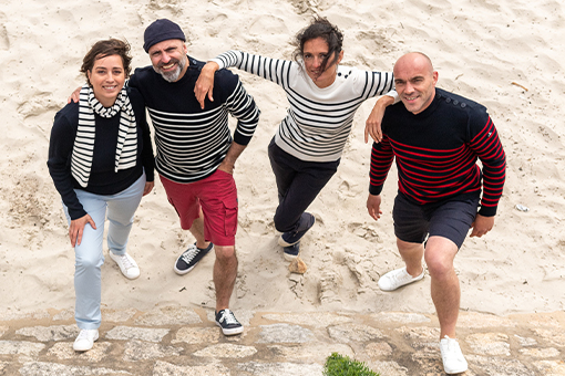 group of friends wearing solid or striped sailor sweater