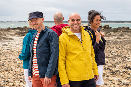 Group of friends wearing jacket in canvas and breton striped shirt
